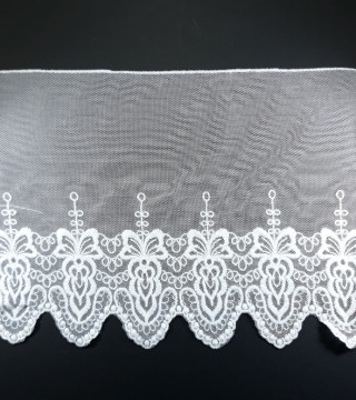 Koronka haft na tiulu – delikatna i elegancka tkanina