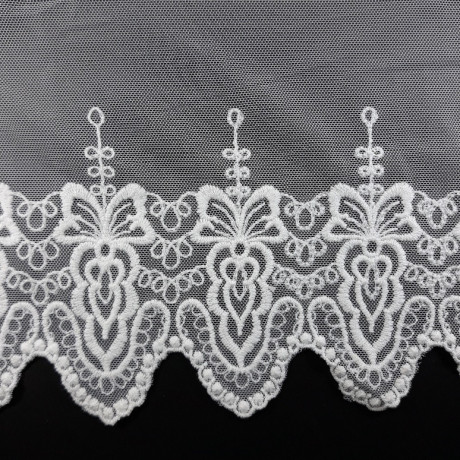 Koronka haft na tiulu – delikatna i elegancka tkanina