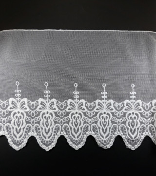 Koronka haft na tiulu – delikatna i elegancka tkanina